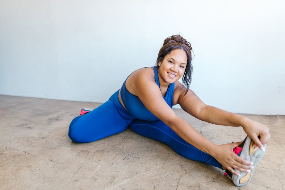 Smiling woman in sportswear relaxing after a yoga session.